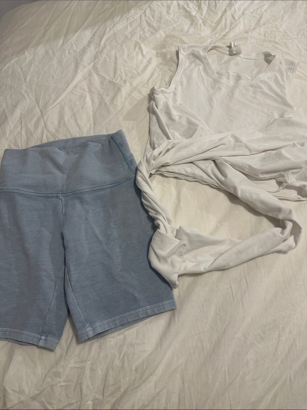 TNA High Rise Bike Shorts and Lululemon tie shirt in Light Blue and white